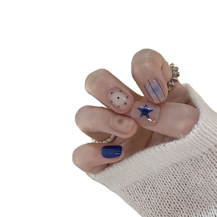 Artificial nails in modern design with geometric and sparkling accents Bowlift