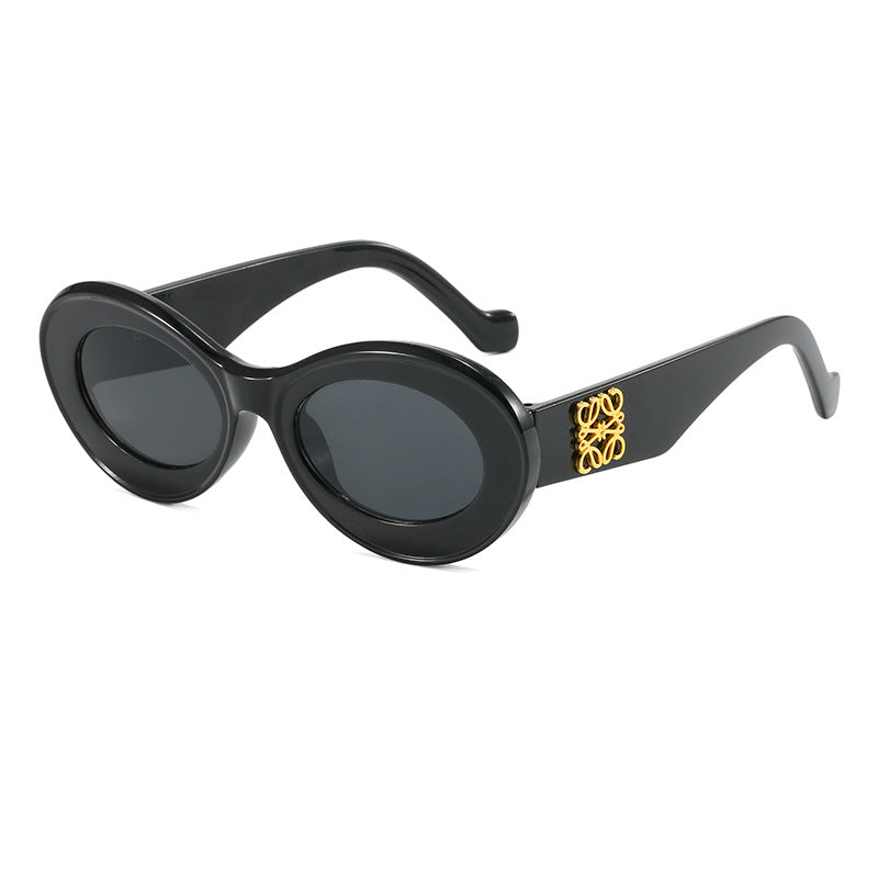 Women's fashionable sunglasses with oval frame and golden applications Bowlift
