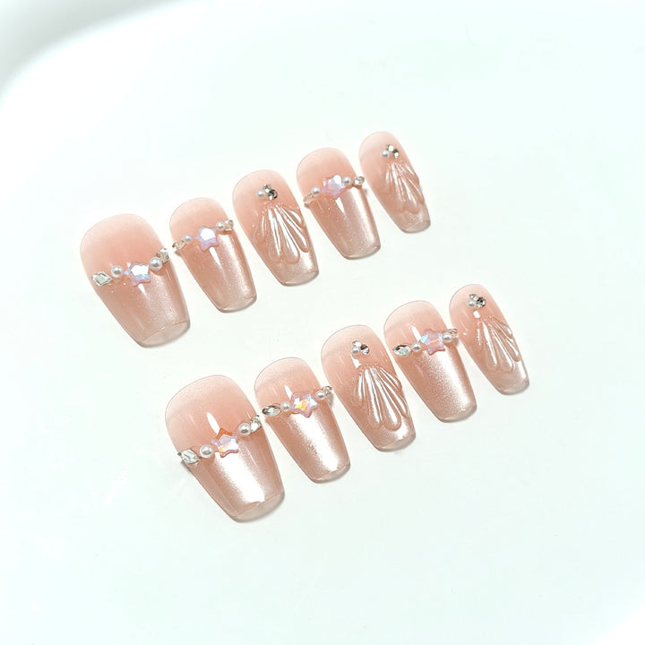 Elegant artificial nails with pearl and rhinestone embellishments Bowlift