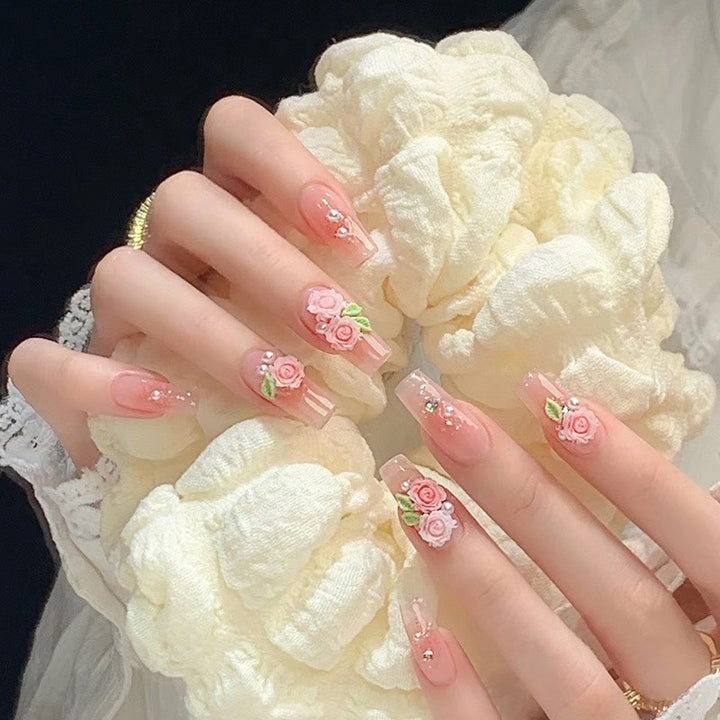 Artificial nails with glitter accents and playful motifs Bowlift