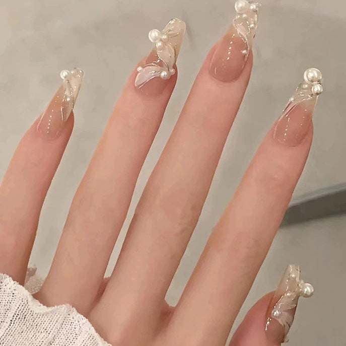 Elegant nail design with pearl embellishment Bowlift