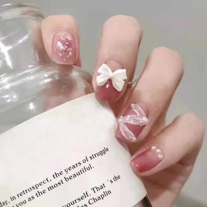 Creative art nails with bows and pearl coating Bowlift