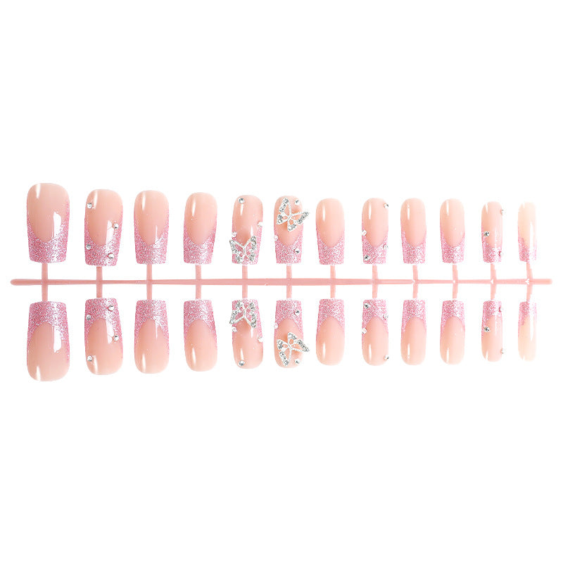 Acrylic nail set with sparkling glitter accents and elegant butterfly motifs Bowlift