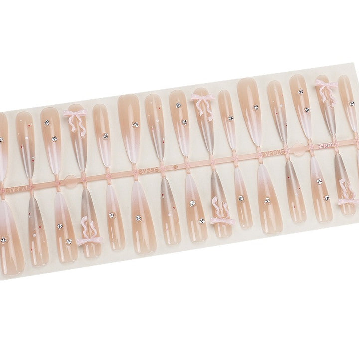Elegant Stiletto Press-On Nails with Decorative Bow and Rhinestone Accents Bowlift