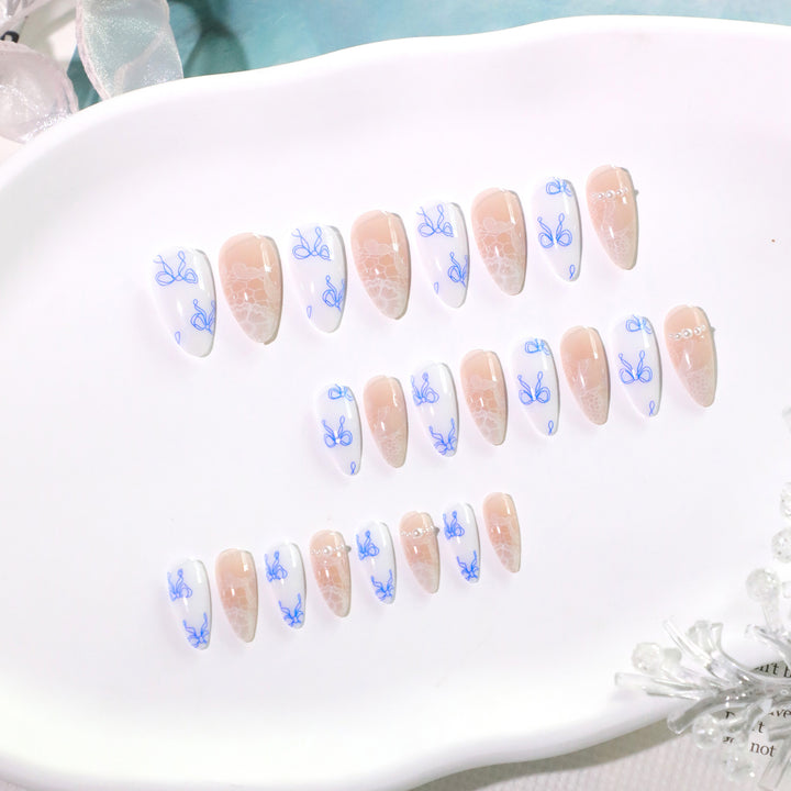 Artistic stiletto nails with delicate bow decorations Bowlift