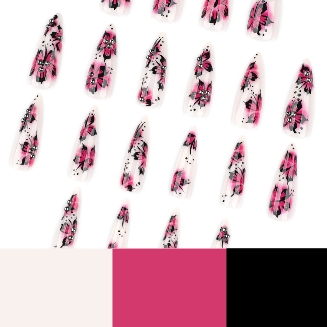 Artful nail art with floral design and rhinestone accents Bowlift