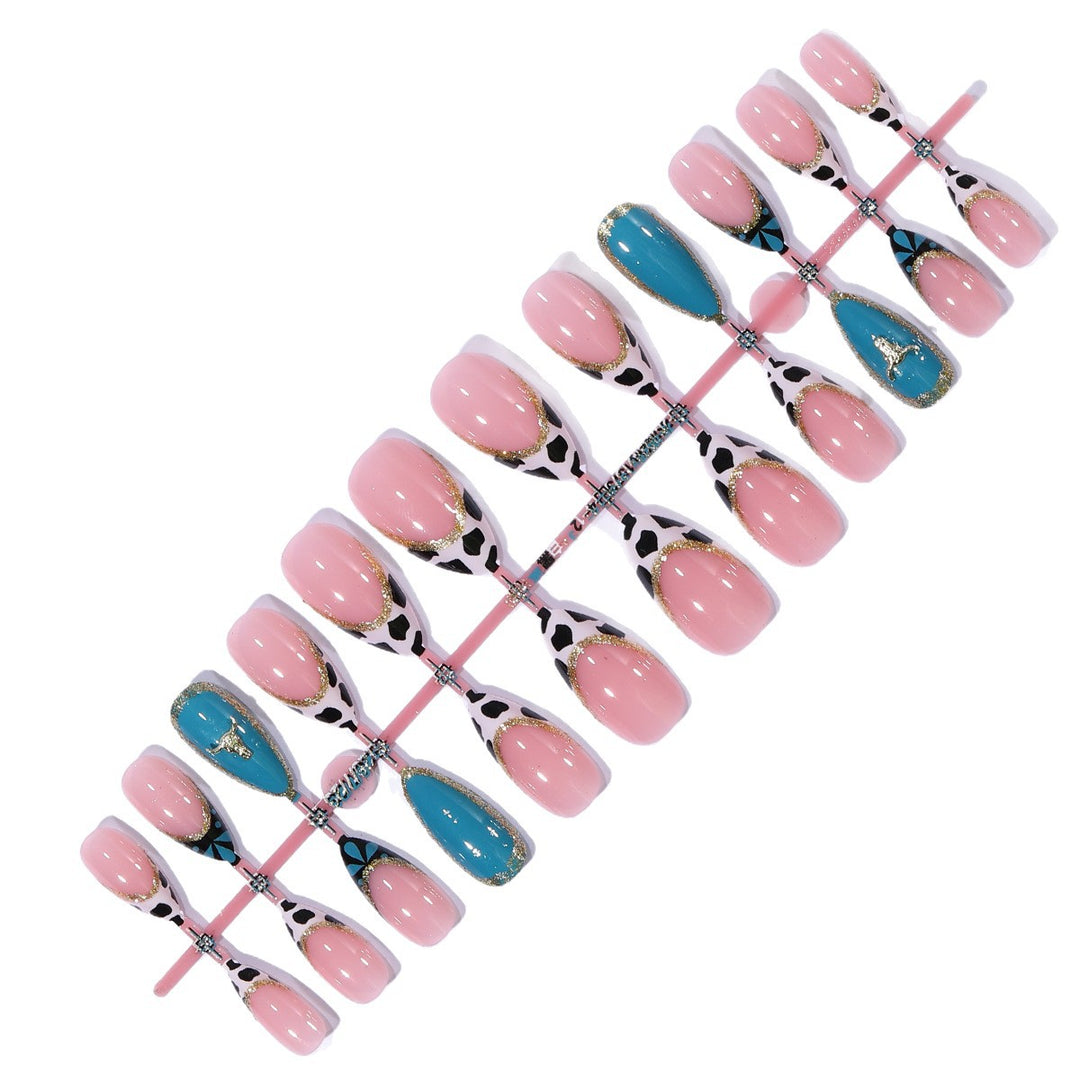 Artistic Stiletto Nail Art Extensions with Cow Print and Gold Accents Bowlift