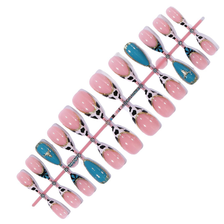 Artistic Stiletto Nail Art Extensions with Cow Print and Gold Accents Bowlift