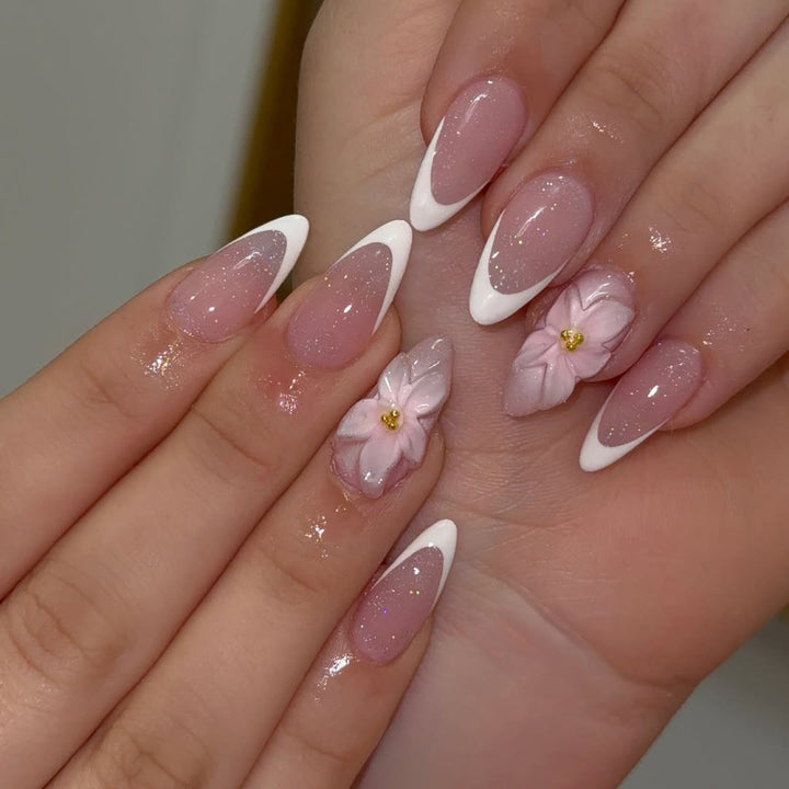 Artistic French-Tip Nail Extensions with Flower Accents Bowlift