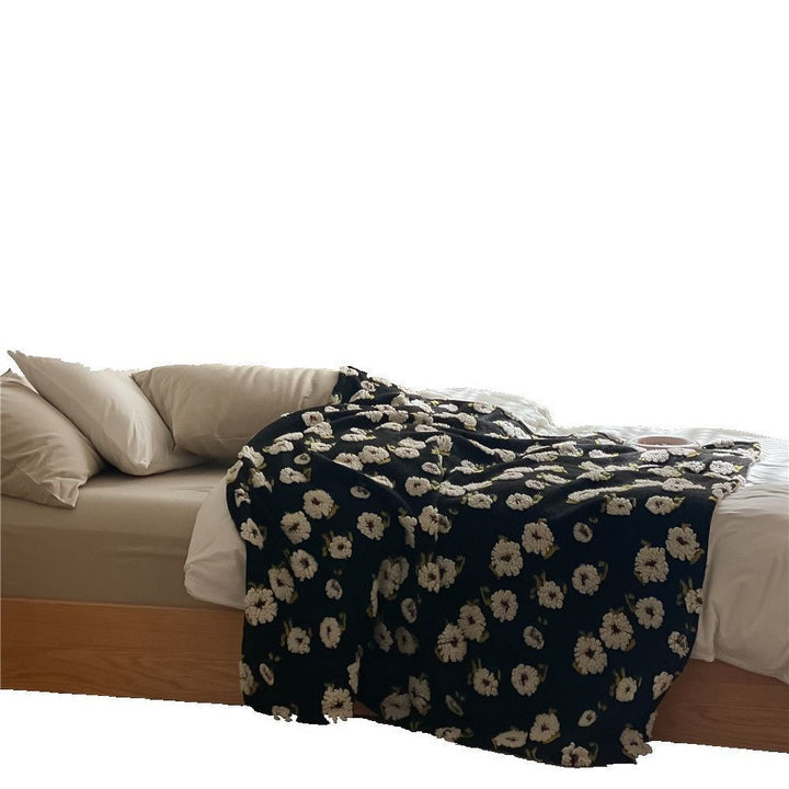 Cuddly blanket with floral bouclé surface and minky reversible fleece