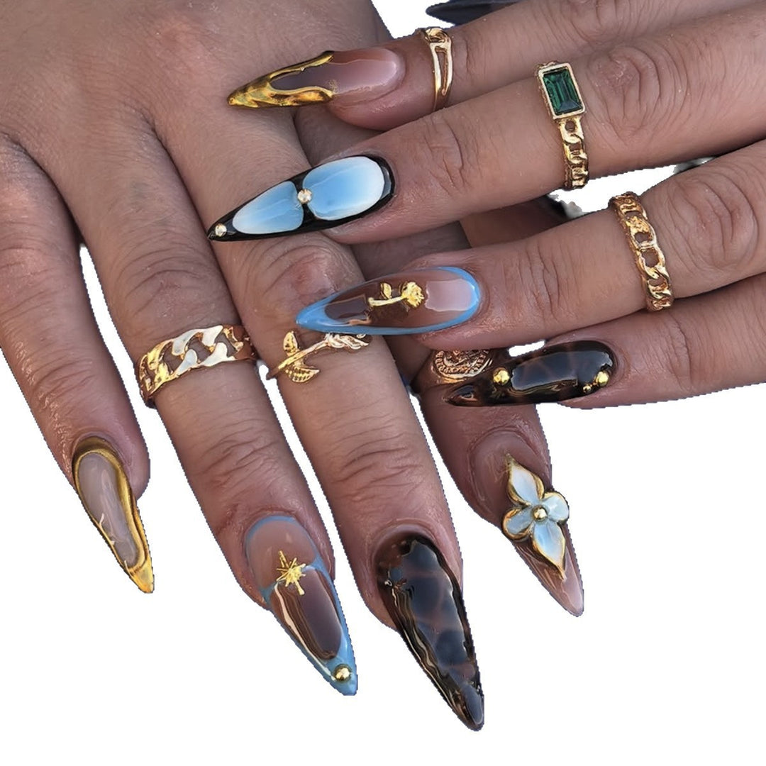 Artificial nail set with luxurious gold design and floral accents Bowlift