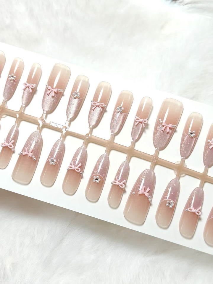 Artificial nails with elegant glitter and bow design Bowlift