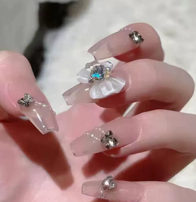 Elegant nail design with pearl embellishment Bowlift