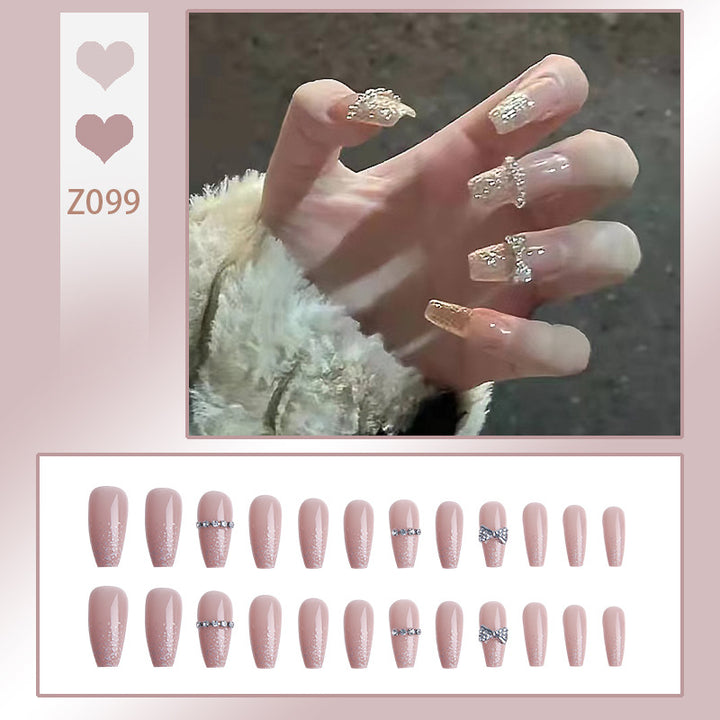 Glamorous artificial nails with sparkling rhinestone and glitter elements Bowlift