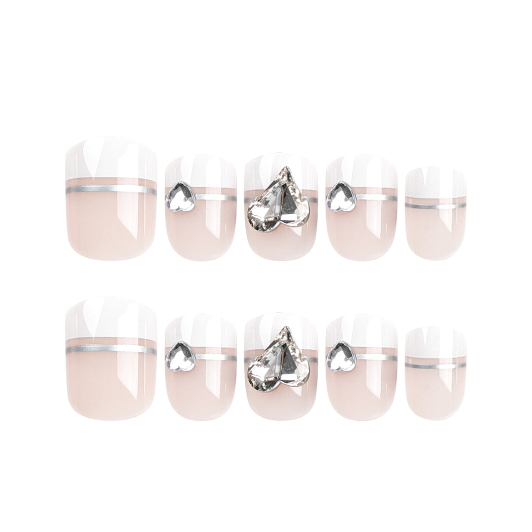 Elegant Nail Art with Glitter Accents and Jewelry Details Bowlift