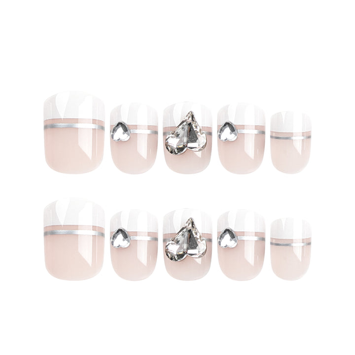 Elegant Nail Art with Glitter Accents and Jewelry Details Bowlift