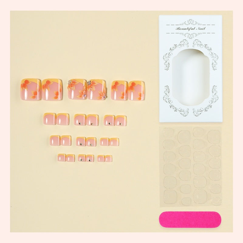 Artificial nail set with floral design and glitter accents Bowlift