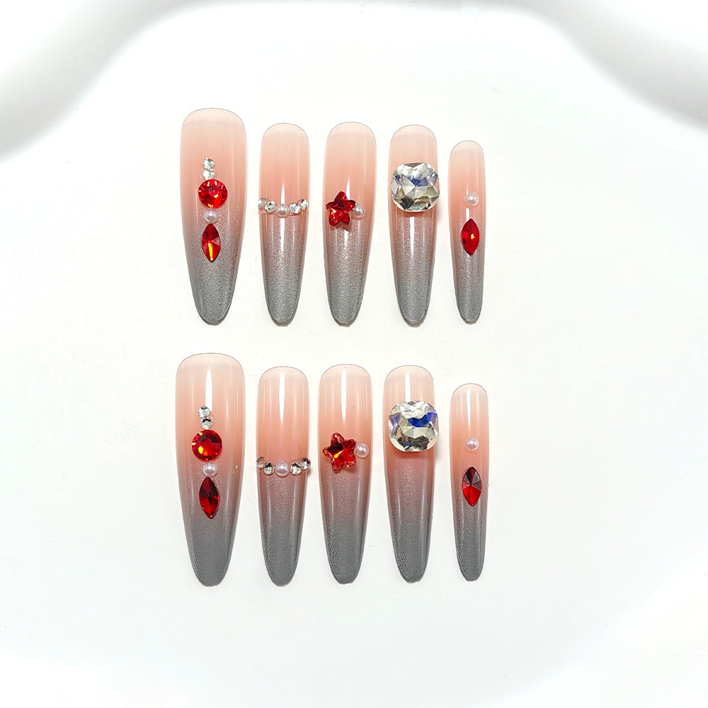 Glamorous artificial nails with rhinestones and embellishments Bowlift