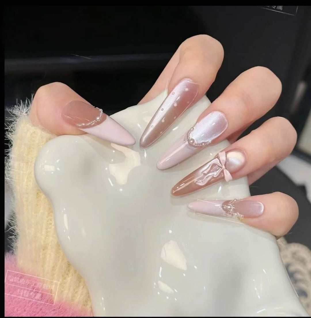 Acrylic nail set with elegant tips and glamorous rhinestone accents Bowlift