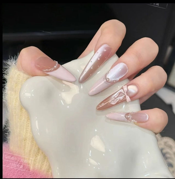 Acrylic nail set with elegant tips and glamorous rhinestone accents Bowlift