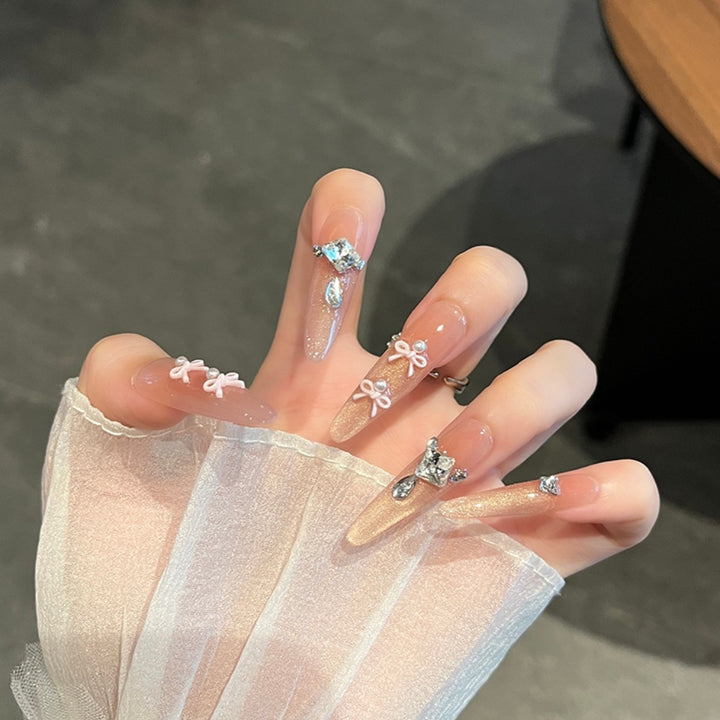 Artistic Stiletto Press-On Nail Art with Glimmering Accents Bowlift
