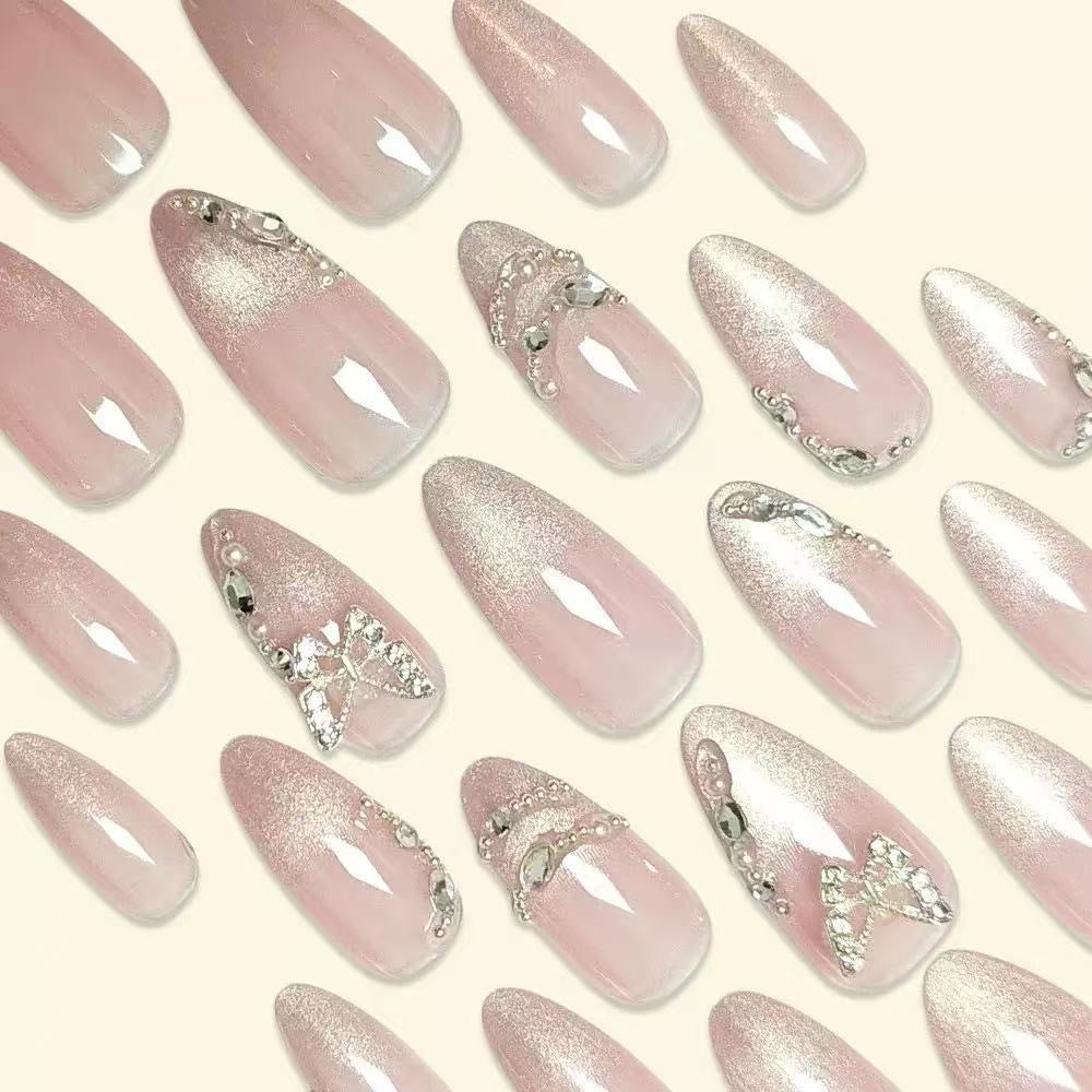 Elegant Stiletto Nail Design with Rhinestone Embellishments Bowlift