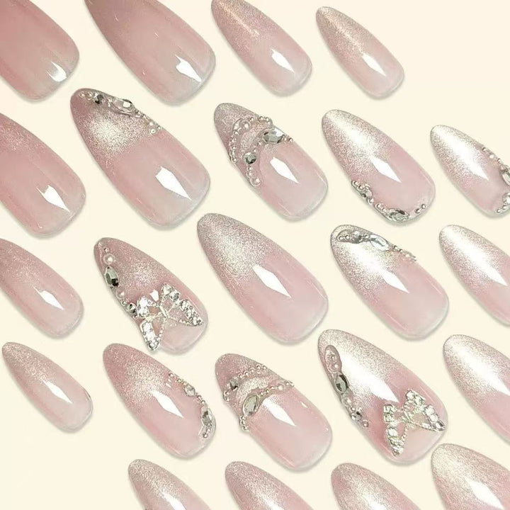 Elegant Stiletto Nail Design with Rhinestone Embellishments Bowlift