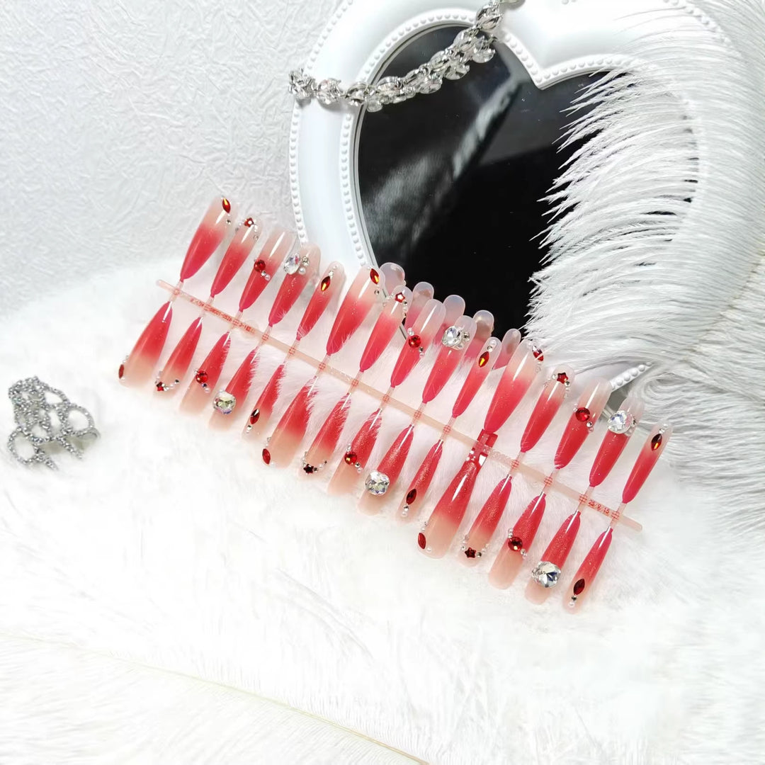 Artificial nails with glamorous glitter and rhinestone embellishments Bowlift