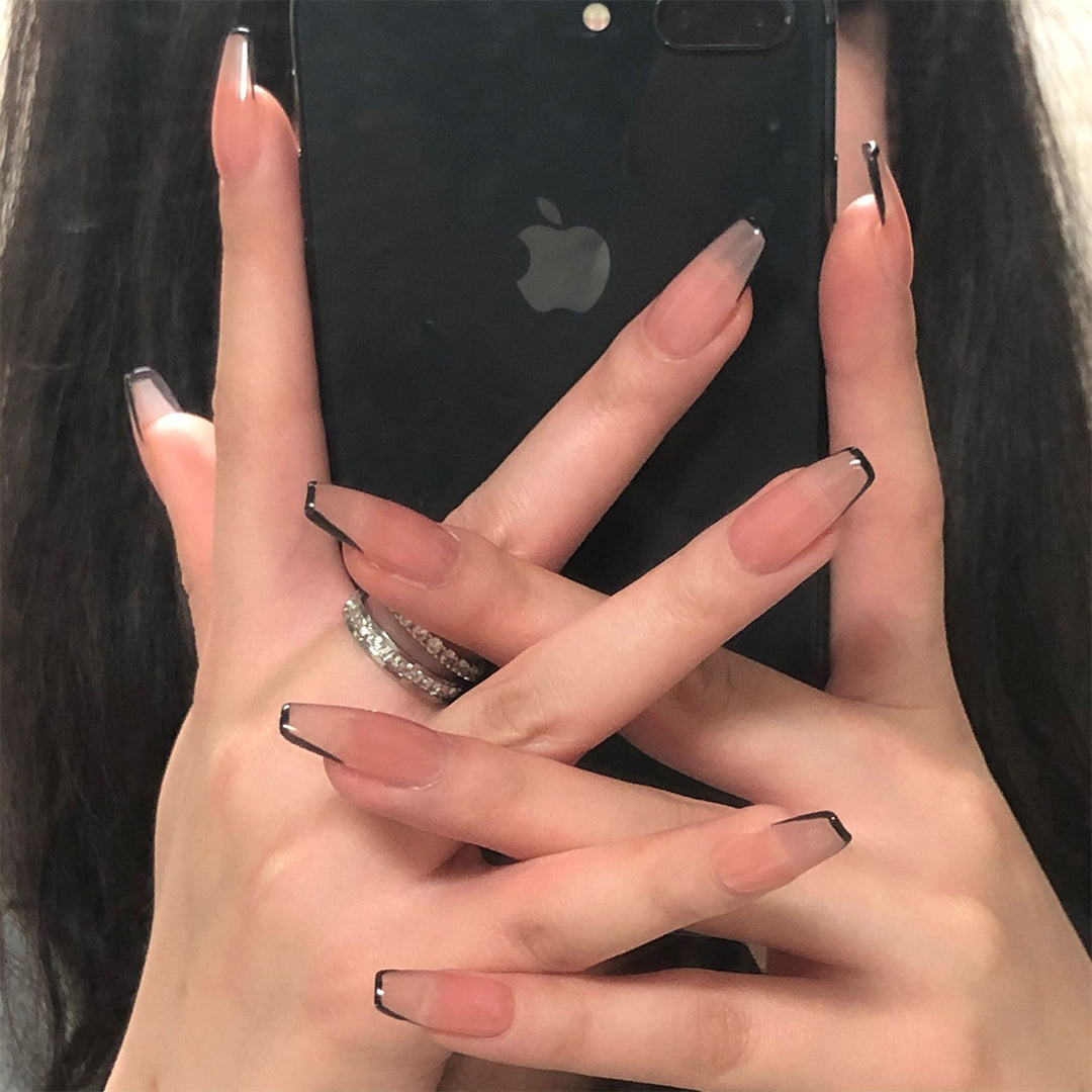 Artful stiletto nails with elegant black tip decoration Bowlift