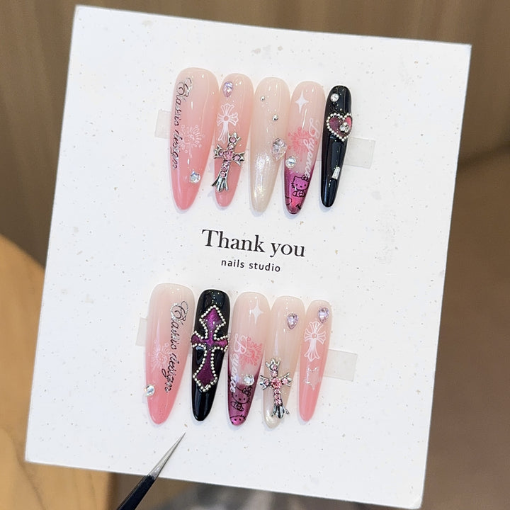 Artificial nails with glamorous accents and sparkling embellishments Bowlift