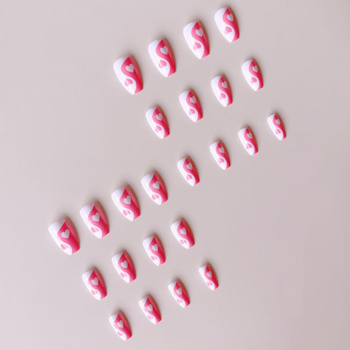 Artificial nails with heart motif and floral accents Bowlift