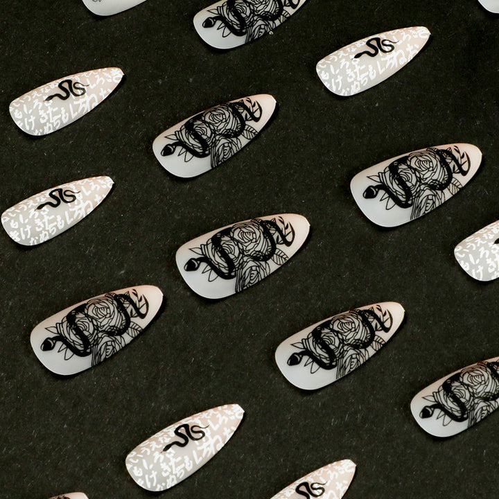 Artful nail extensions in elegant stiletto style with artistic floral and graphic designs Bowlift