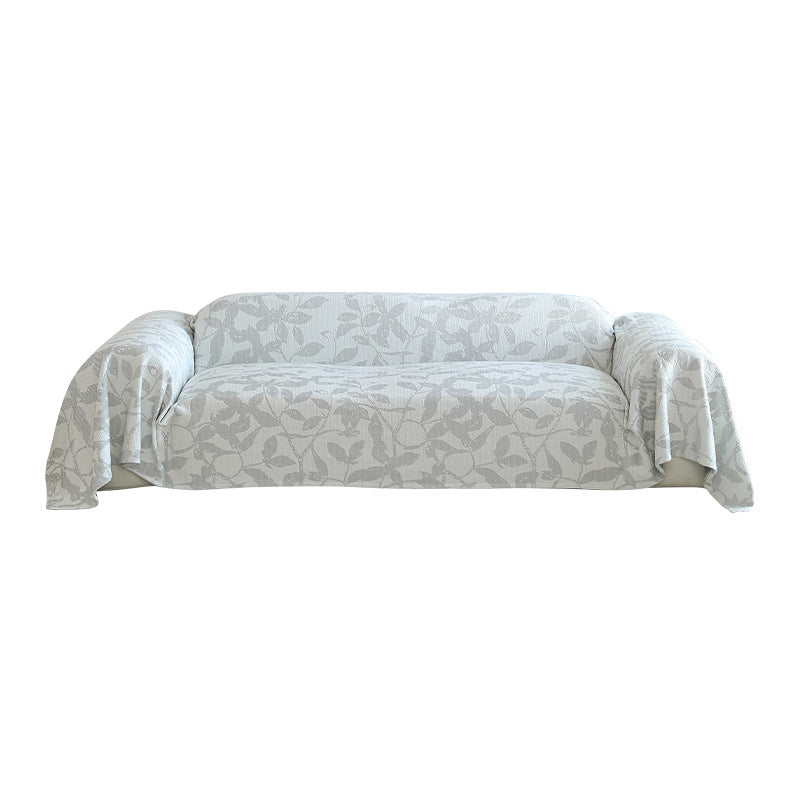 Elastic sofa cover with floral relief structure and universal fit