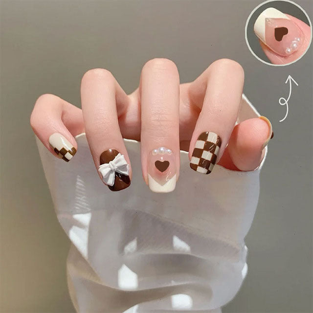 Artificial nails with heart accent and glamorous decorations Bowlift