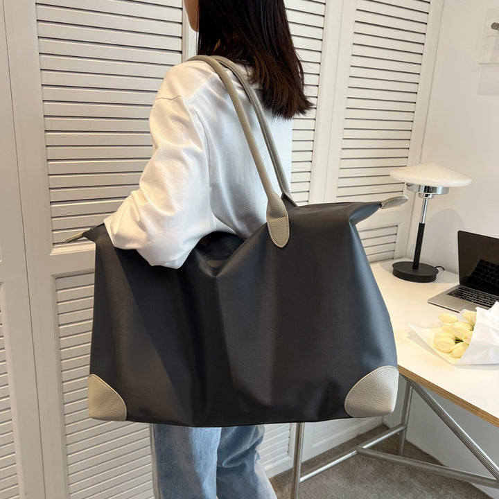 Large travel bag with durable material and multiple compartments Bowlift
