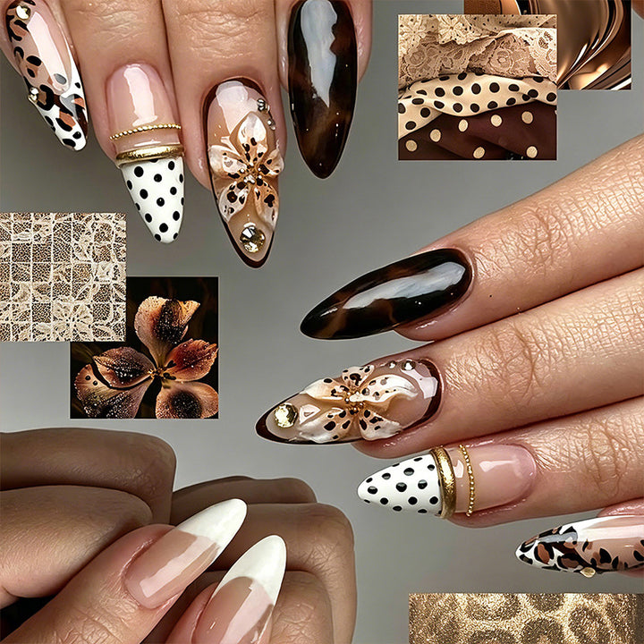 Artificial nail set with glamorous floral designs and creative glitter accents Bowlift