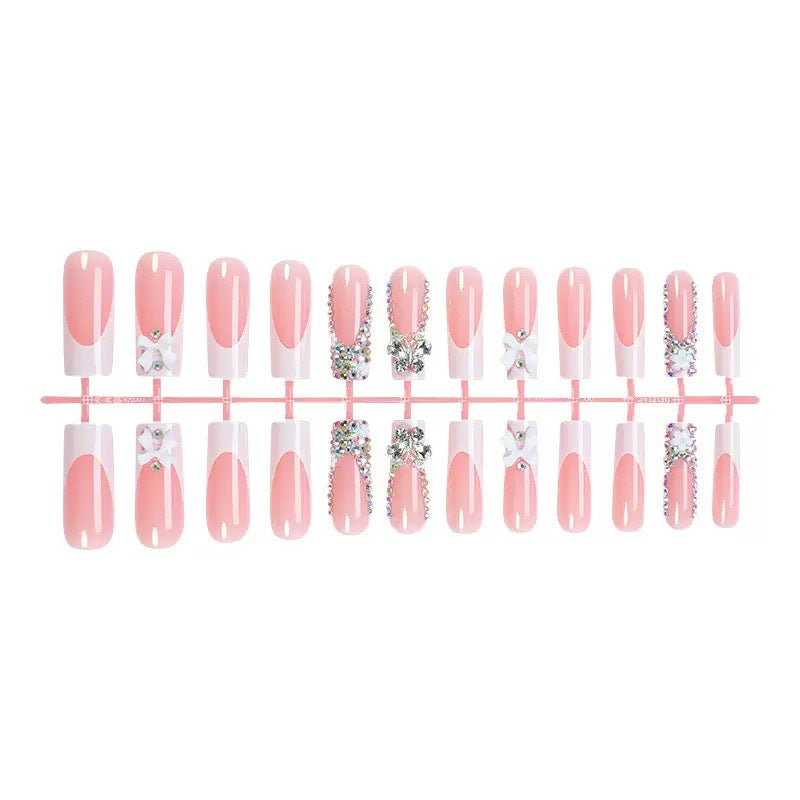 Artificial nail set with shimmering rhinestone decorations and floral design Bowlift