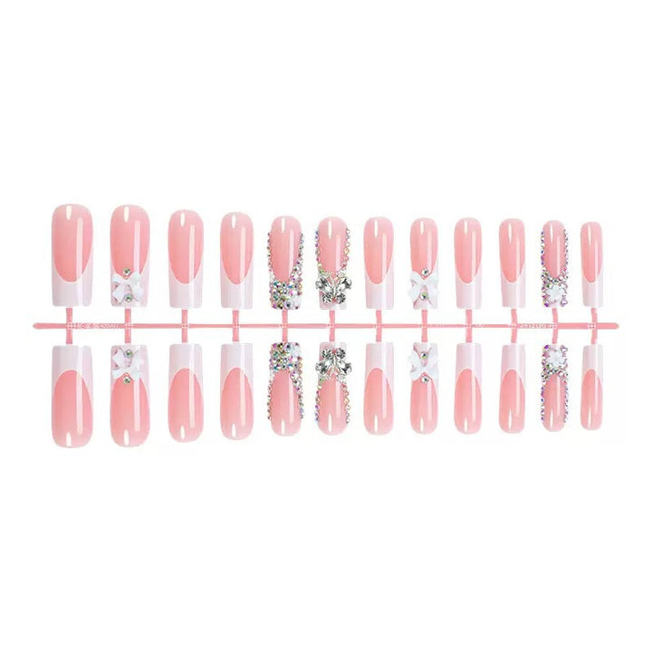 Artificial nail set with shimmering rhinestone decorations and floral design Bowlift