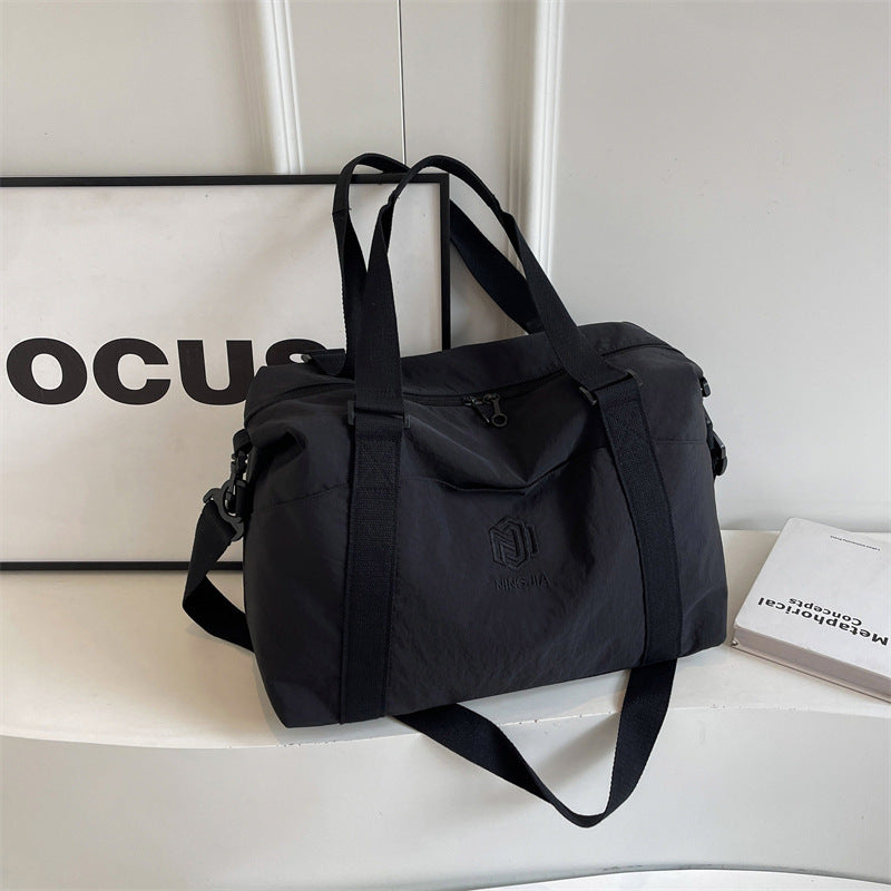 Sporty tote bag with multiple compartments and adjustable straps Bowlift