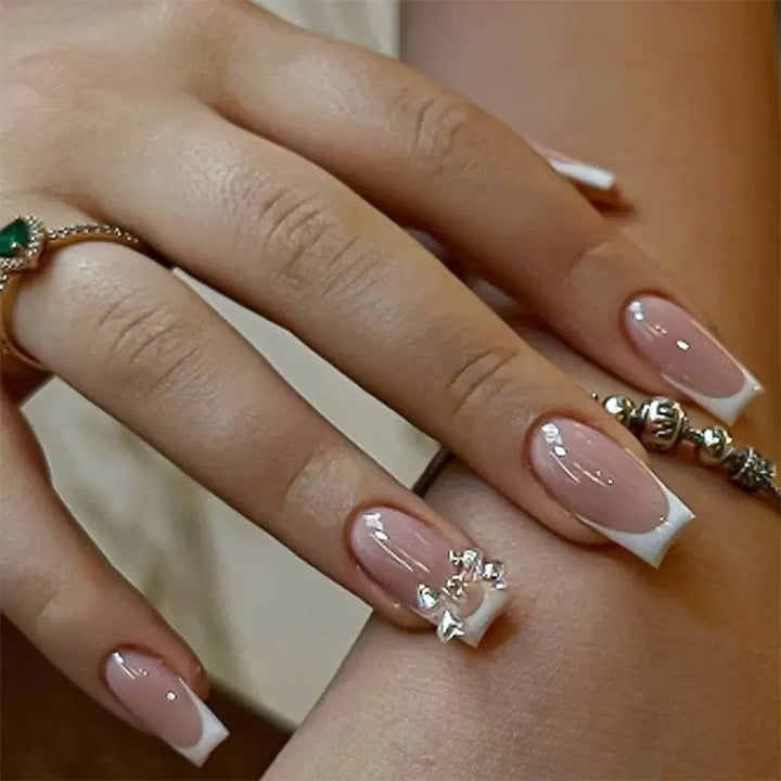 Artificial nail set with glamorous French tips and sparkling accents Bowlift