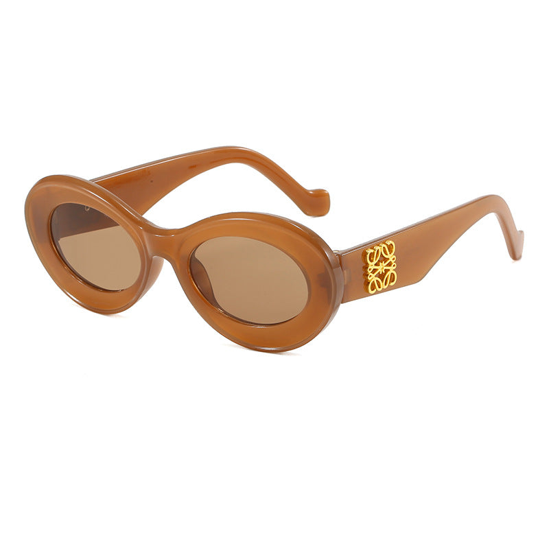 Women's fashionable sunglasses with oval frame and golden applications Bowlift