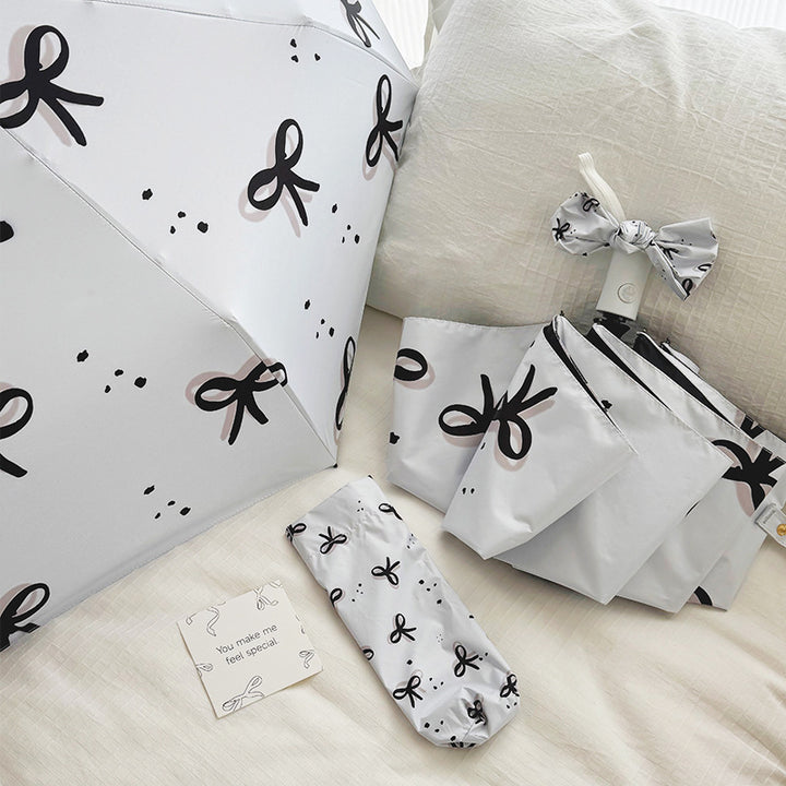 Women’s Folding Umbrella with Playful Bow Pattern Bowlift