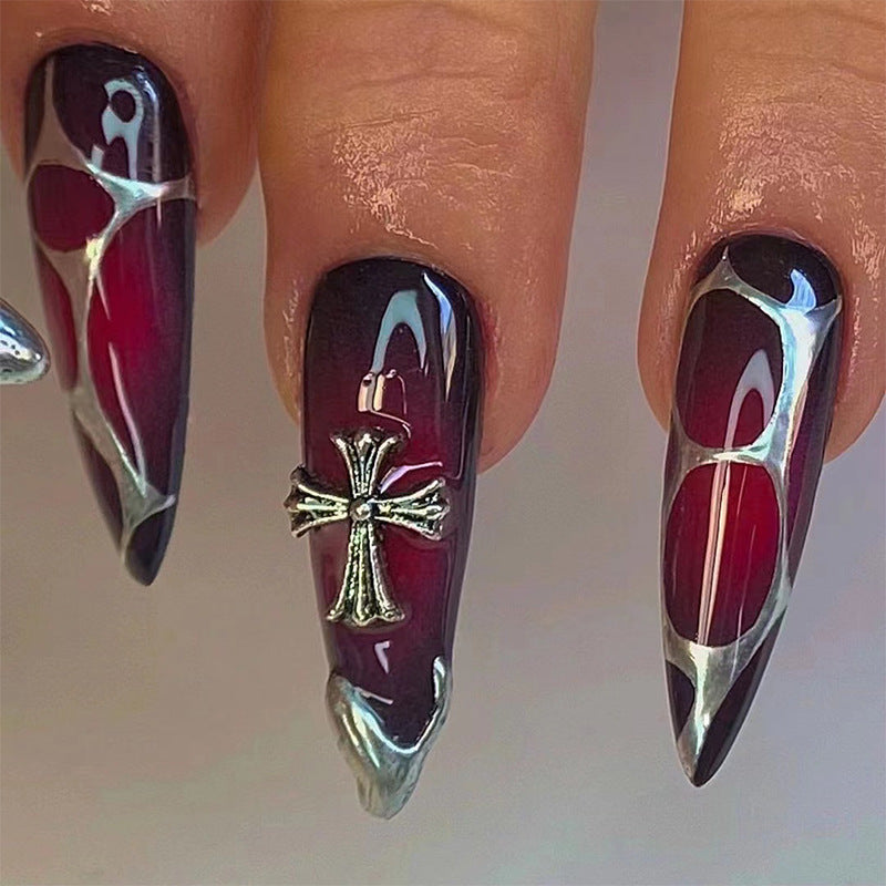 Artful Stiletto Nails with Elegant Cross Decoration Bowlift