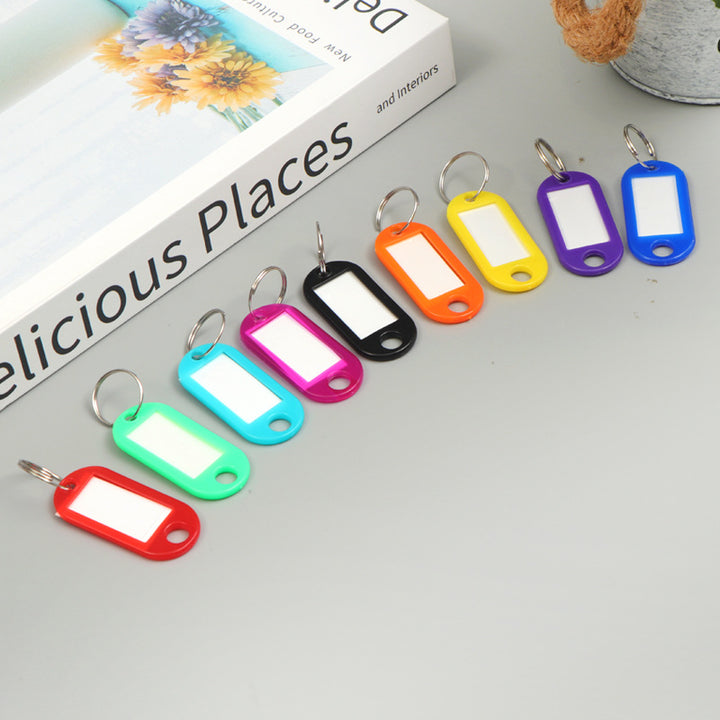 Unisex writable keychain with clear labeling field Bowlift