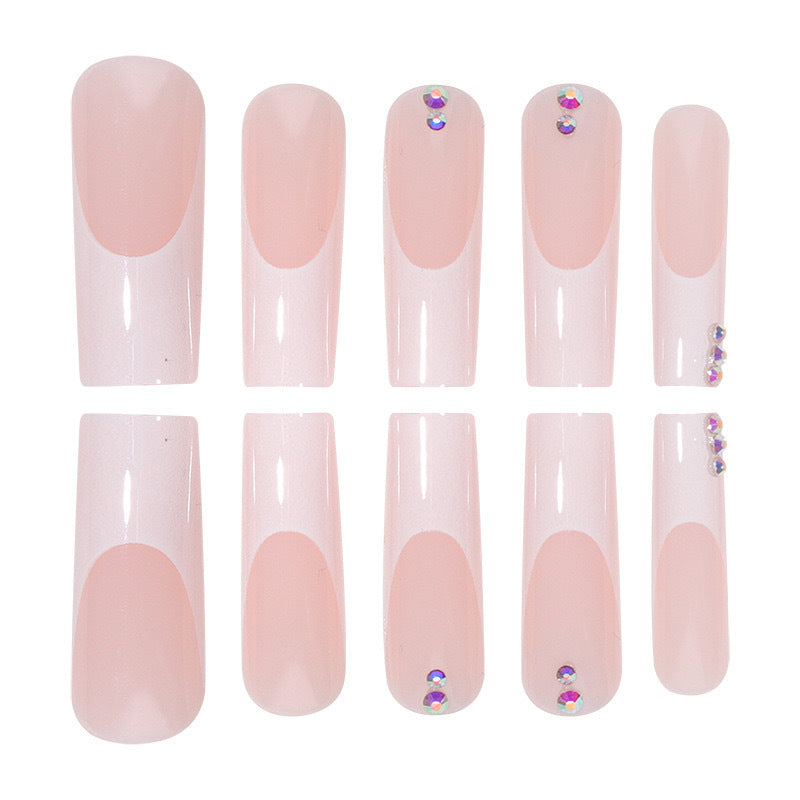 Nail set with elegant French tips and sparkling rhinestone embellishments Bowlift
