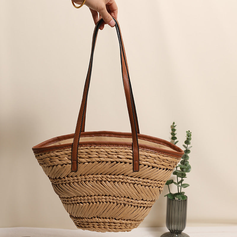 Braided basket bag with innovative leather handles Bowlift