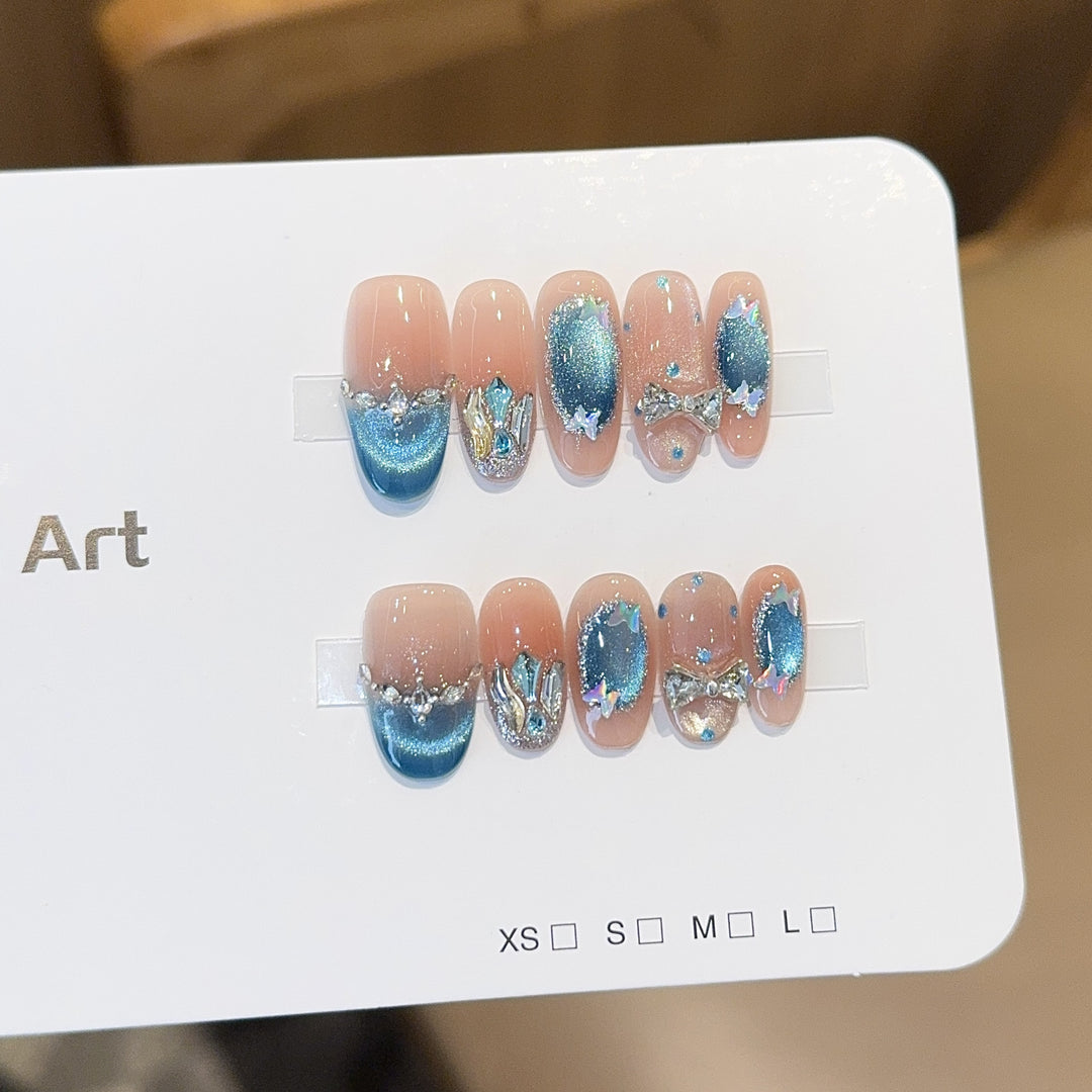 Artificial nail tips with glitter and watercolor effect Bowlift