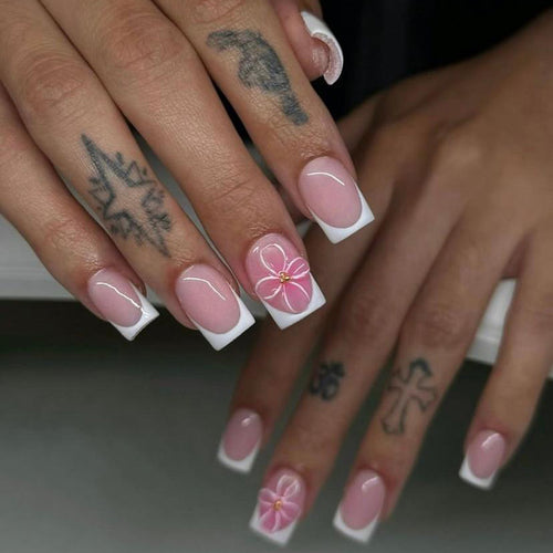 Artistic nail art with delicate flowers and elegant French lace Bowlift