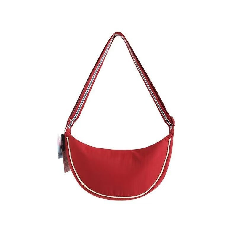 Shoulder bag with adjustable shoulder strap and versatile interior compartment Bowlift