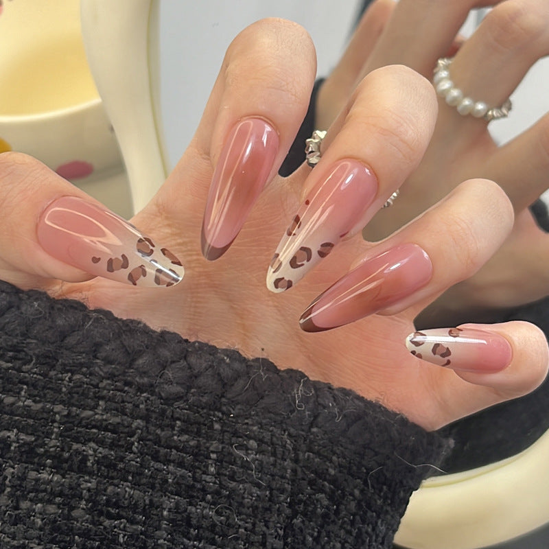 Artistic Stiletto Press-On Nail Design with Leopard Accents Bowlift